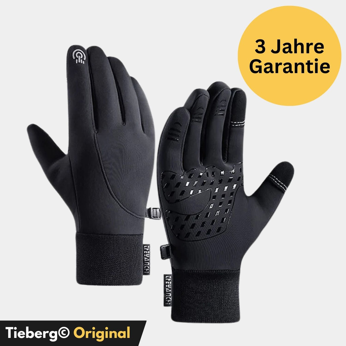 Tieberg - Thermo Handschuhe gegen kalte Hände mit rutschfester Silikonbeschichtung und Touch-Fingern werden vor hellem Hintergrund gezeigt. Ein gelber Kreis zeigt "3 Jahre Garantie". Unten ist das Tieberg® Original Branding sichtbar.