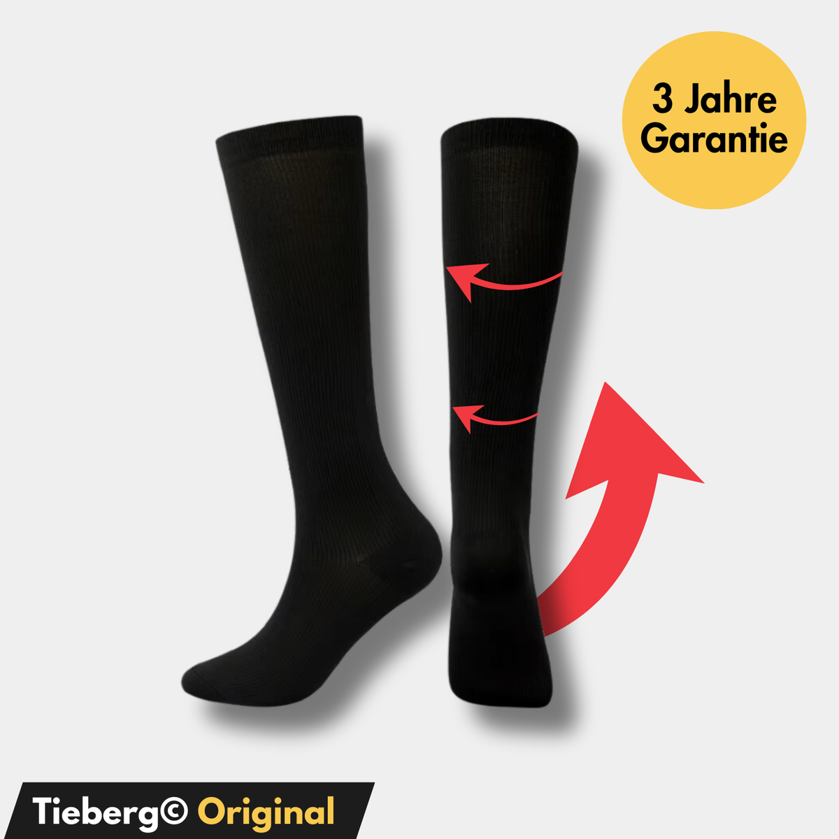 Ein Paar schwarze VitalSocks™ Kompressionsstrümpfe von Tieberg™️ mit roten Pfeilen für Elastizität, einem gelben Kreis "3 Jahre Garantie" oben rechts und einem schwarz-gelben Banner "Tieberg™️ Original" unten links.