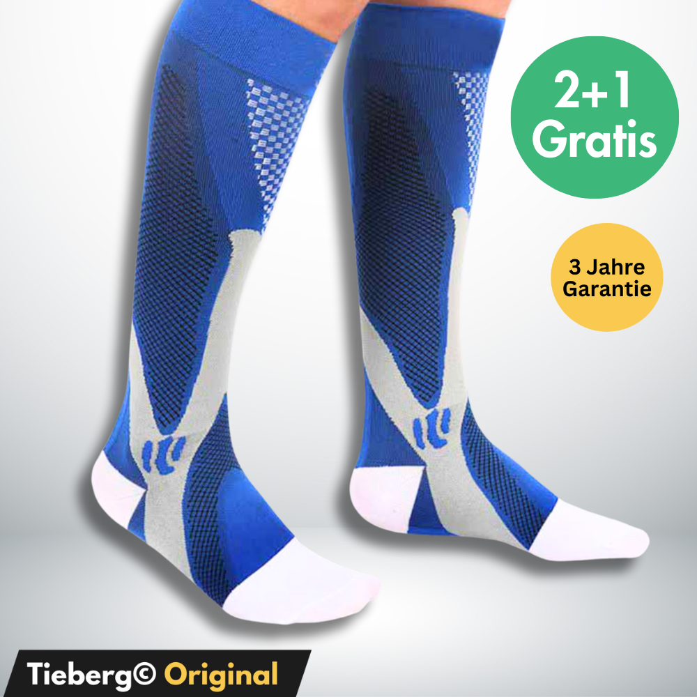 Ein Paar blaue und graue Tieberg™️ - Spezial Kompressionsstrümpfe mit fortschrittlicher Kompressionstechnologie. Kreisförmige Etiketten zeigen 2+1 Gratis, 3 Jahre Garantie. Auf dem unteren Banner steht Tieberg™️ Original in schwarz und gelb.